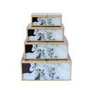 Marble-style decorative boxes stacked on display