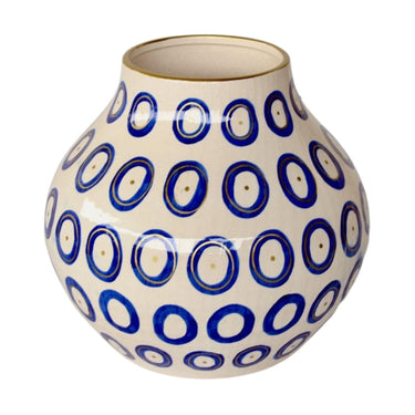 Decorative blue vase featuring gold detailing and elegant circular design.