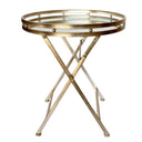 Round mirrored butlers tray table with foldable pale gold metal base on white background