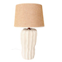White ceramic table lamp with cactus-inspired ridged base and soft beige fabric shade