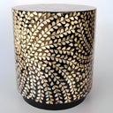 Close-up of round top and gold vine pattern on Capizo Accent Table