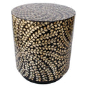 Angled view of lightweight drum-shaped accent table with shimmering gold details
