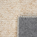 Close-up of thick woven texture on plush cosy rug