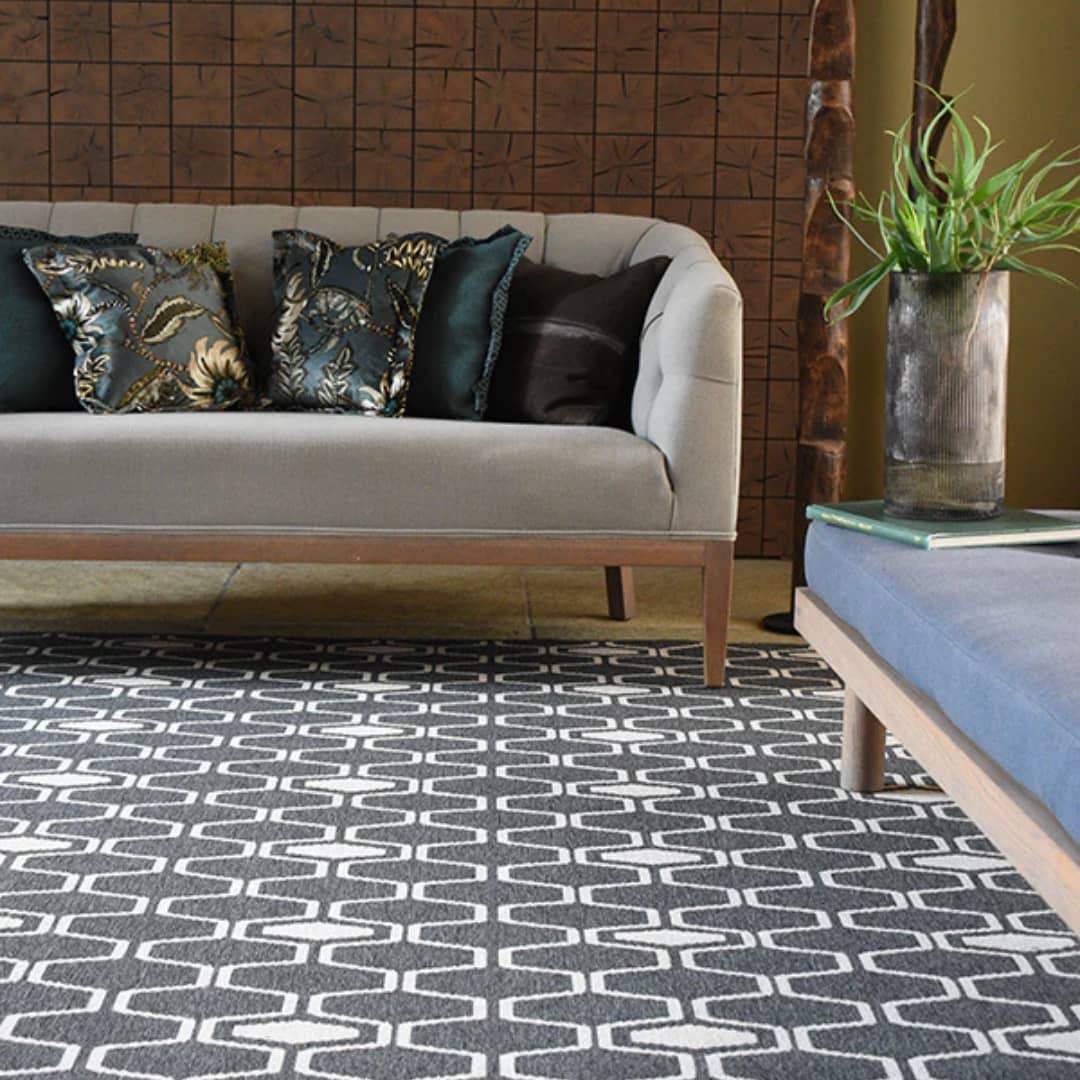 Connection Grey Reversible Rug under a living room couch.