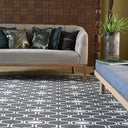 Connection Grey Reversible Rug under a living room couch.