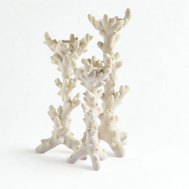 Decorative white candle holders with round bases and coral-inspired sculptural detailing, fits tealights