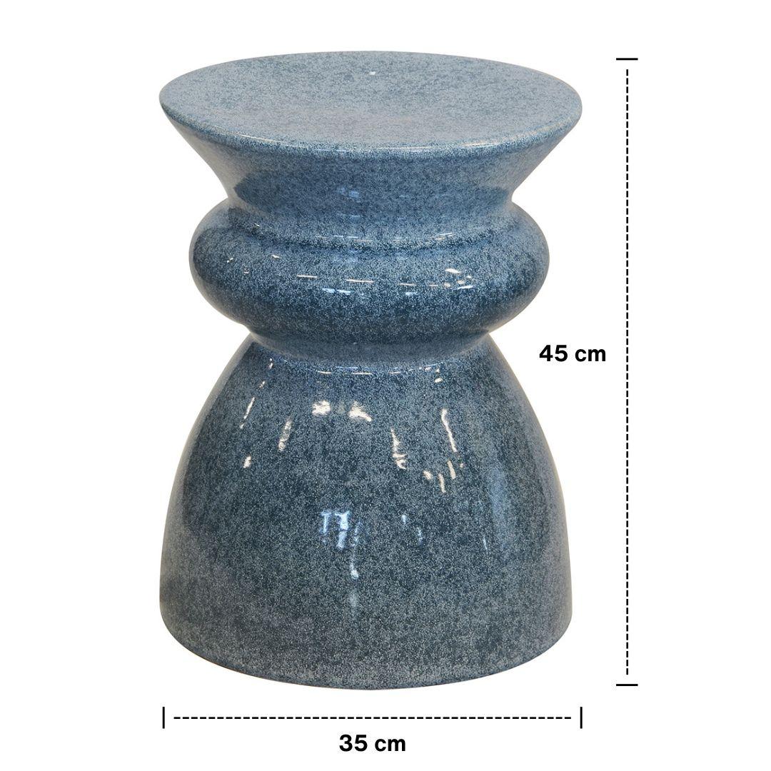 Glossy dark blue ceramic side table with rounded shape. Compact side table or end table for living room or bathroom styling.