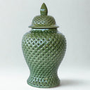 Large green ceramic ginger jar with a cut out design
