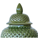 pierced detailing with a flared base and pointed lid.