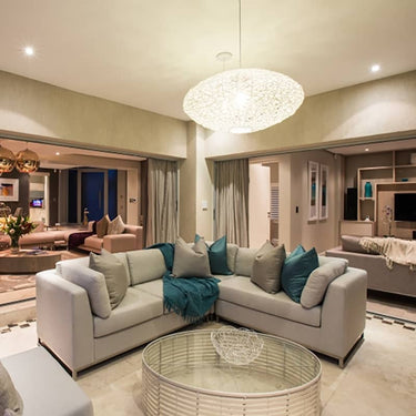 Eclipse Woven Resin Pendant Light hanging in living room