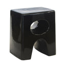 Glossy black ceramic stool with smooth curves. Stylish ceramic stool for indoor or covered patio use.