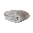 Frostveil Fur throw with frosted faux fur texture and soft mink backing, shown in snowflake.