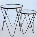 Set of two round glass top metal side tables with black frame for modern interiors