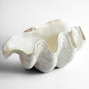 A giant clam shell decor bowl is sculptural resin with realistic detail, perfect for towels, fruit or decorative styling