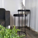 Leah nesting side tables styled in a bedroom corner with wood floors and ceramic leopard decor