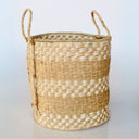 Neutral-toned seagrass basket with woven detailing.