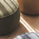 Nigella Ottoman in Comet Grasslands fabric, deep green with swivel base and piped edge in a modern, nature-inspired setting