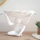 White textured monkey bowl used as a fruit bowl centerpiece.