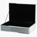 Open jewellery box showing suede-lined interior