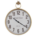 Clock with a bronze frame and bee detail at the top.