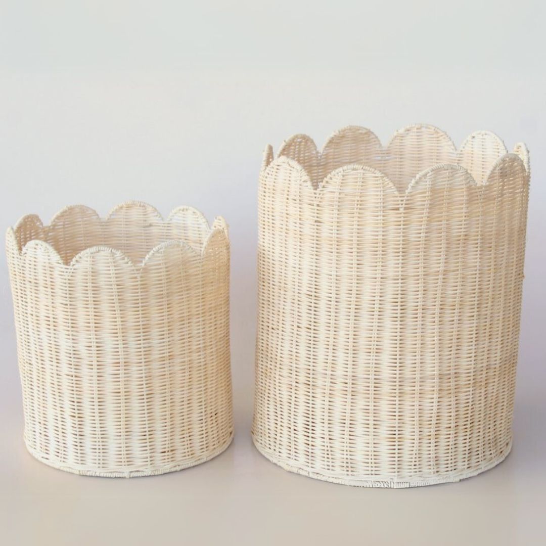 Set of 2 handwoven rattan baskets with scalloped edge finish for home organization.