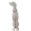 Dog figurine in seated pose from stone with gold collar