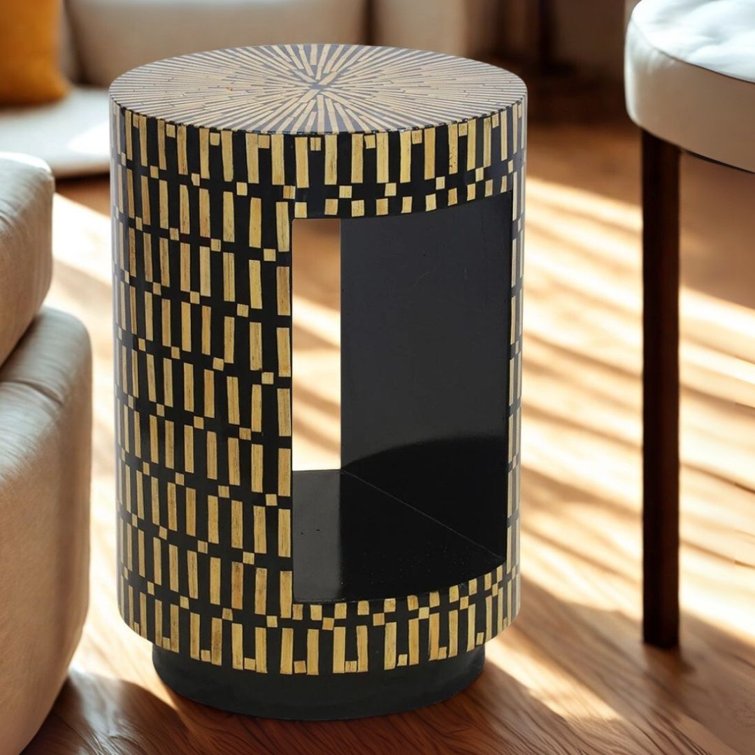 Decorative cylindrical side table with geometric pattern on a wooden floor.