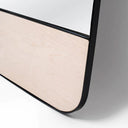 standing mirror with powder-coated steel frame and birch plywood accent.