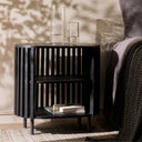 Swedish Nightstand in black, crafted from solid mango wood with elegant brass feet, in a stunning bedroom
available online at Woodka Interiors South Africa.