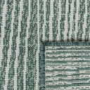 Close-up of polypropylene weave on the Tangram reversible geometric outdoor rug in hunter
