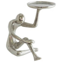Thinker Candle Holder made from raw silver metal with abstract figure design