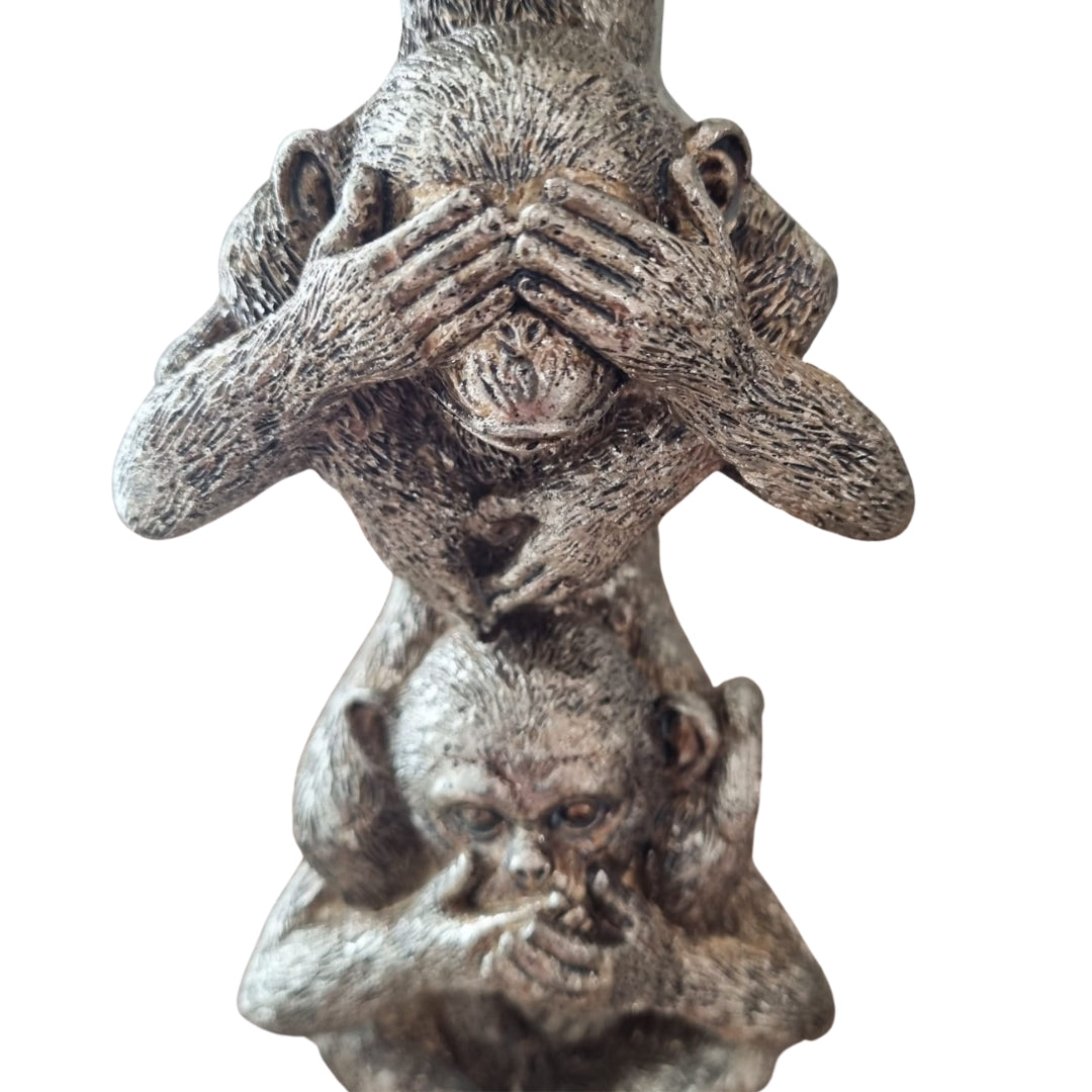 three wise monkey figurines