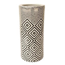 Black and white ceramic umbrella stand with a geometric pattern for functional and decorative use.