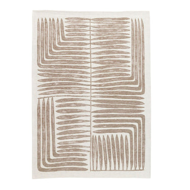 rug with soft botanical motifs woven into clean geometric lines