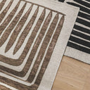 Vertigo Rug in Hazel with geometric and botanical design, styled in a soft-toned bedroom floor