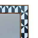 decorative mirror frame with a geometric design