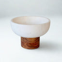 Best view of marble and wood bowl styled on counter