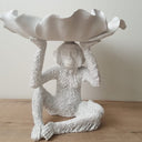 White Monkey Display Bowl sitting on a wooden table