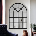Classic black arched window pane mirror in living room