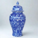 Blue and white ceramic jar with a lid on
