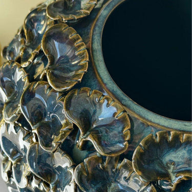 close u of the case Modern ceramic flower vase in teal with sculptural petal design