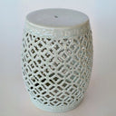 Indoor photo of crackle ceramic garden stool used as side table or footrest