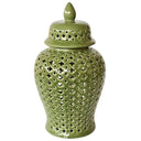 A green ginger jar with a detailed cut-out pattern and a lid.