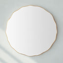 Gold scalloped wall mirror with elegant curved frame
