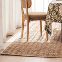 Large natural jute rug with textured weave styled in dining room