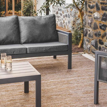 Styled outdoor seating area with Kasbah Outdoor Rug on patio