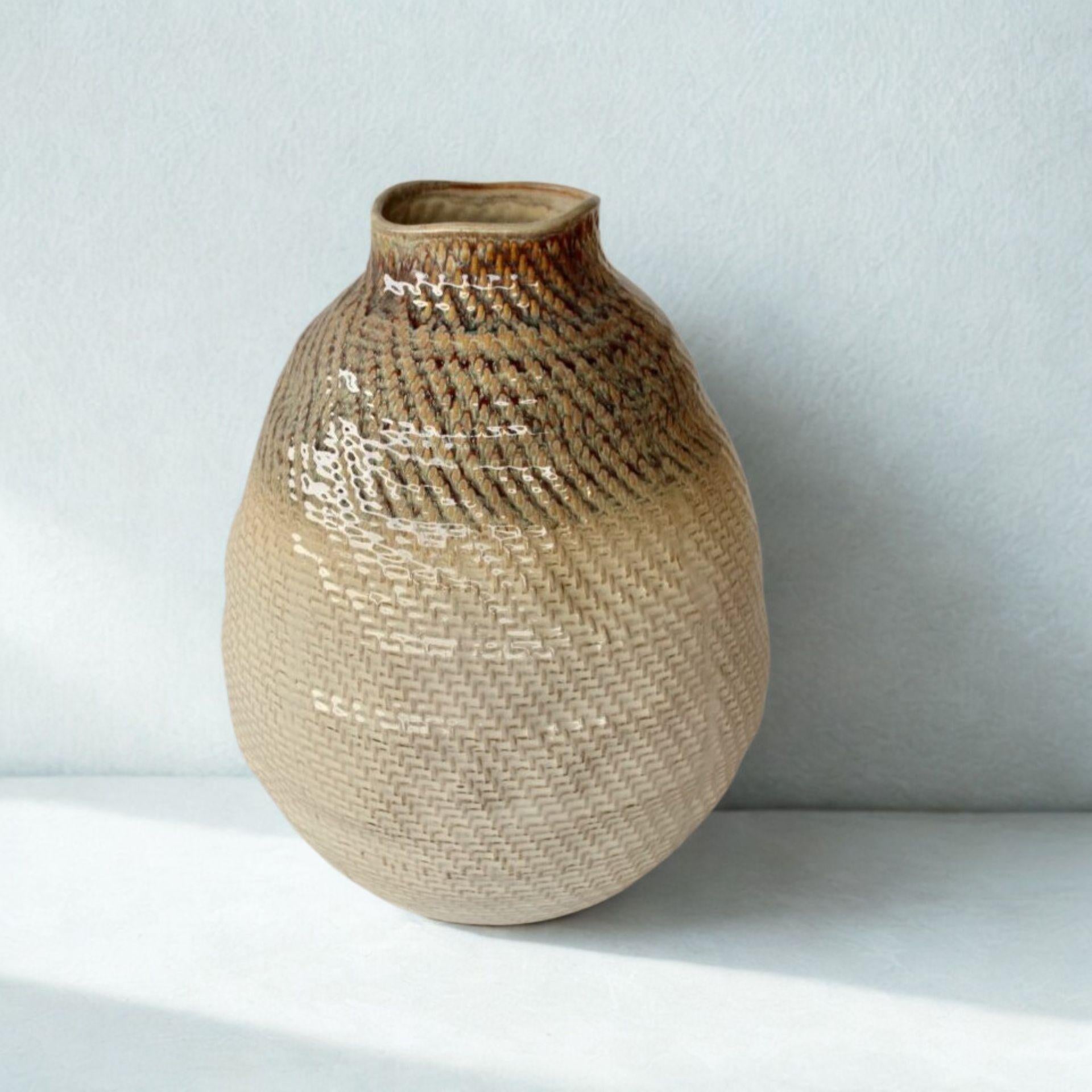 Large cream and brown ceramic vase with basket weave texture and glossy finish