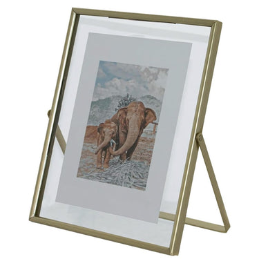 Floating glass frame with gold metal edges and a built-in stand.