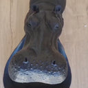 Tabletop display of hippo candy bowl styled with keys and wallet