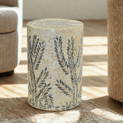 Cream round side table with mother-of-pearl finish